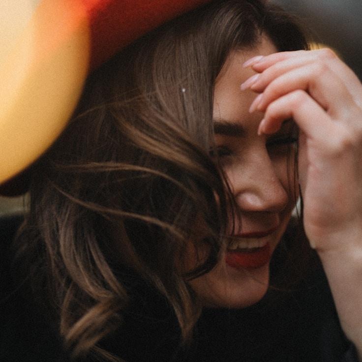 Amina Desai, Lead Design Curator at RiverStoneCore, reviewing corporate floral arrangements